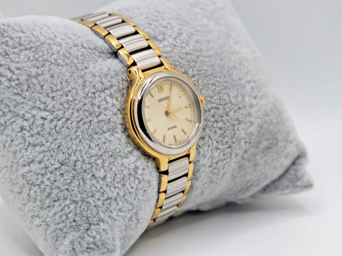 Seiko Avenue 1F21-0H50 ladies’ quartz two-tone watch with gold dial, silver hour markers, and new battery.