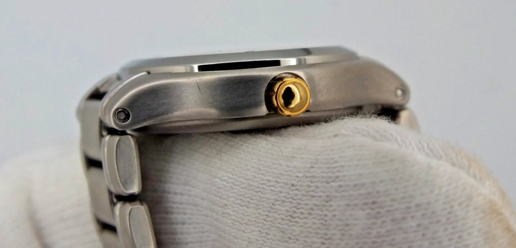 Silver titanium Citizen Exceed A930 watch with gold near-mint dial, black hour markers, and linked metal band.