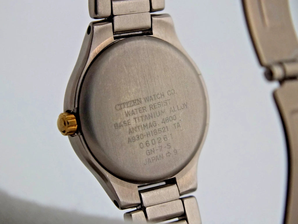Silver titanium Citizen Exceed A930 watch with pearl dial, black text, and “Citizen Watch Co. Water Resist.”