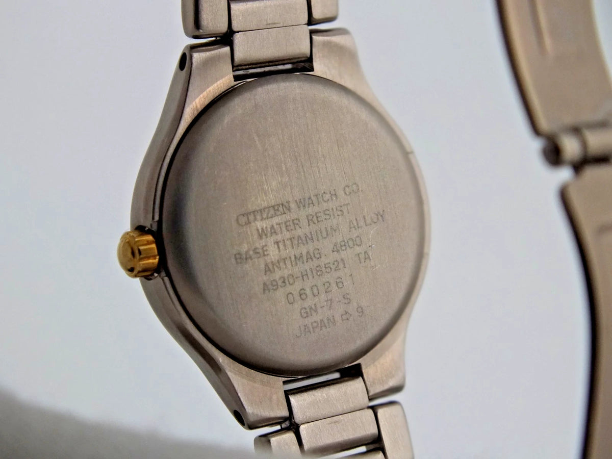 Silver titanium Citizen Exceed A930 watch with pearl dial, black text, and “Citizen Watch Co. Water Resist.”